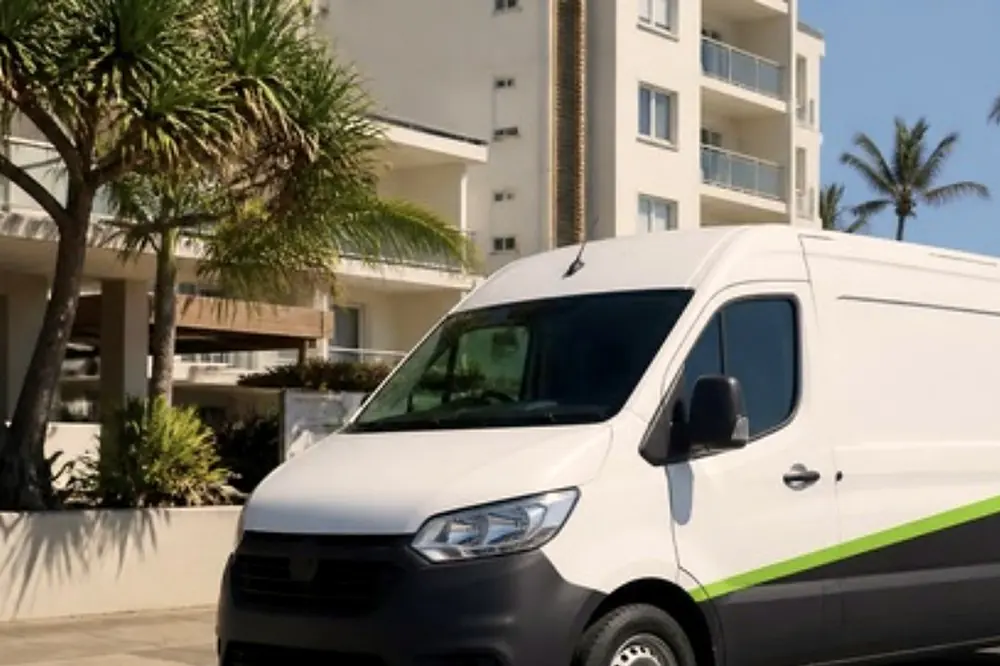 White Laser Printers service van parked on a Sunshine Coast street outside a low rise office building